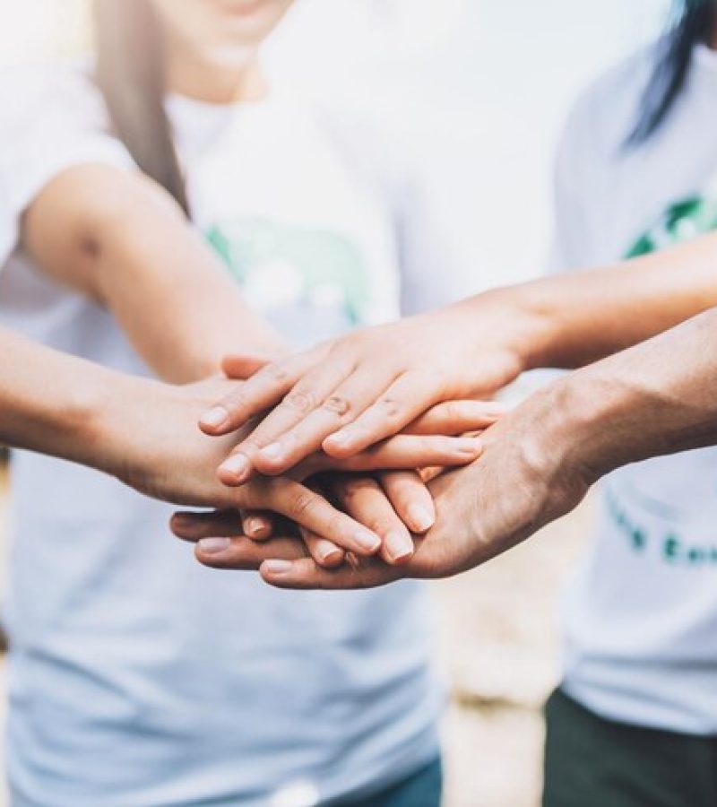 close-up-people-volunteer-teamwork-putting-finger-star-shapehands-togetherstack-handsunity-teamwork-world-environment-day_640221-299